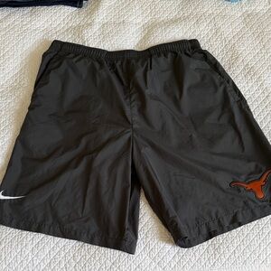 Nike Men's Black Shorts with Orange Logo